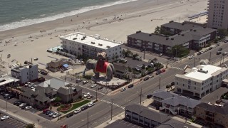 AX71_209E - 5.1K aerial stock footage orbiting Lucy the Margate Elephant, Margate City, New Jersey
