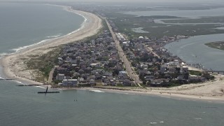 AX71_234 - 5.1K aerial stock footage approaching beachfront community in Strathmere, New Jersey