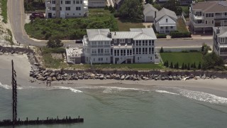 AX71_235 - 5.1K aerial stock footage flying over a beachfront home in Strathmere, New Jersey