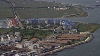 AX71_258 - 5.1K aerial stock footage of waterfront apartment complex near Grassy Sound Bridge in North Wildwood, New Jersey