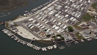 AX71_262 - 5.1K aerial stock footage of a waterfront mobile home park in Wildwood, New Jersey