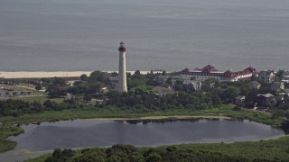 AX72_006 - 5.1K aerial stock footage of the Cape May Lighthouse and Lighthouse Pond, New Jersey