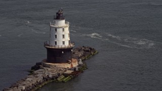 AX72_020E - 5.1K aerial stock footage flying by the Harbor of Refuge Light, Delaware
