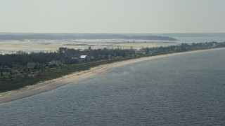 AX72_039 - 5.1K aerial stock footage of a row of beachfront homes in Prime Hook Beach, Delaware