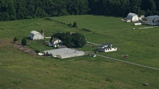AX72_086 - 5.1K aerial stock footage of a farmhouse, barns, and greenhouses in Dover, Delaware