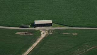 AX72_102 - 5.1K aerial stock footage of a barn next to a crop field in Ingleside, Maryland