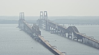 AX72_129E - 5.1K aerial stock footage flying by the Chesapeake Bay Bridge, Maryland