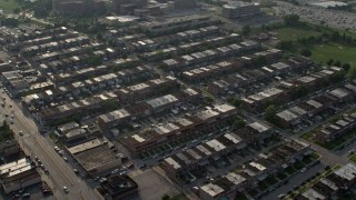 AX73_060 - 5.1K aerial stock footage flying by a neighborhood of row houses in Baltimore, Maryland