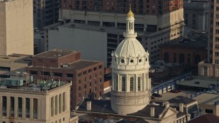 AX73_119 - 5.1K stock footage aerial video of the Baltimore City Hall dome in Downtown Baltimore, Maryland