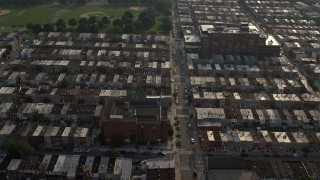AX73_140 - 5.1K stock footage aerial video of urban row houses, streets, and Highlandtown Elementary School in Baltimore, Maryland