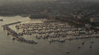 AX73_149 - 5.1K aerial stock footage of boats docked at Anchorage Marina at sunset in Baltimore, Maryland