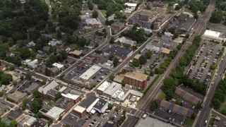 AX74_004 - 4.8K aerial stock footage flying over water tower, shops and streets in Manassas, Virginia