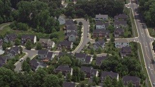 AX74_014 - 4.8K aerial stock footage of suburban homes by quiet streets in Fairfax, Virginia