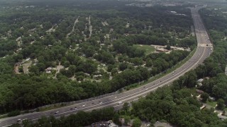 AX74_019 - 4.8K aerial stock footage flying over freeway, approaching an elementary school in Springfield, Virginia
