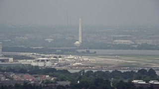AX74_028 - 4.8K aerial stock footage of White House, Washington Monument and Jefferson Memorial seen from Reagan National in Washington DC