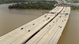 AX74_030 - 4.8K aerial stock footage of light traffic on the Woodrow Wilson Memorial Bridge over the Potomac River
