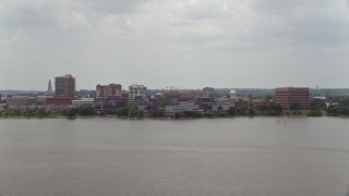 AX74_031 - 4.8K aerial stock footage of office buildings by the Potomac River in Alexandria, Virginia