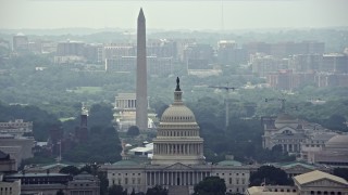 AX74_054 - 4.8K stock footage aerial video of the United States Capitol and Supreme Court, reveal National Mall Monuments in Washington DC