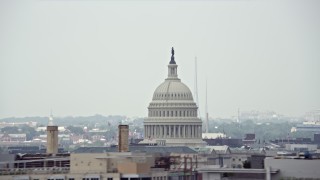 AX74_062 - 4.8K aerial stock footage of the United States Capitol Dome and a construction crane in Washington DC