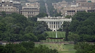 AX74_070E - 4.8K aerial stock footage of The White House and South Lawn in Washington DC