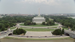 AX74_074 - 4.8K aerial stock footage orbiting Lincoln Memorial to reveal the Reflecting Pool and Washington Monument in Washington DC