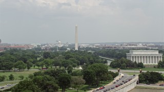 AX74_076 - 4.8K stock footage aerial video of a view across the National Mall at the United States Capitol and the Washington Monument in Washington DC