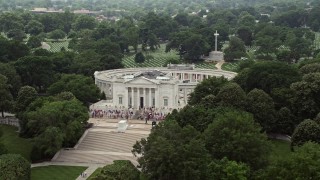 AX74_113 - 4.8K stock footage aerial video flying by the Tomb of the Unknown Soldier Monument with tourists at Arlington National Cemetery, Washington DC