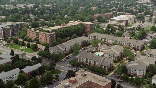 AX74_119 - 4.8K stock footage aerial video flying by apartment complexes in Arlington, Virginia