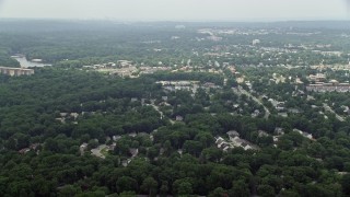 AX74_124 - 4.8K aerial stock footage of suburban homes and trees in Alexandria, Virginia