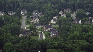 AX74_130 - 4.8K aerial stock footage of large, upscale homes on quiet streets in Springfield, Virginia