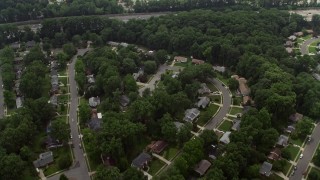 AX74_131E - 4.8K aerial stock footage of a bird's eye view of suburban homes and I-495 in Springfield, Virginia