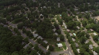AX74_133 - 4.8K aerial stock footage tilting to a bird's eye view of a suburban neighborhood in Springfield, Virginia