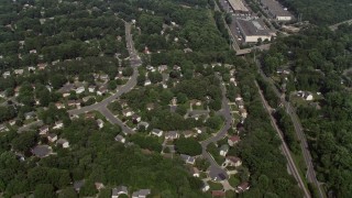 AX75_020E - 4.8K aerial stock footage of a bird's eye view of suburban neighborhoods and streets in Burke, Virginia
