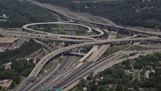 AX75_025 - 4.8K stock footage aerial video approaching I-495 and 395 freeway interchange in Springfield, Virginia