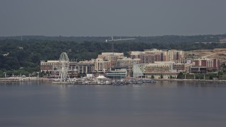 AX75_039 - 4.8K aerial stock footage approaching marina and Capitol Wheel at National Harbor, Maryland