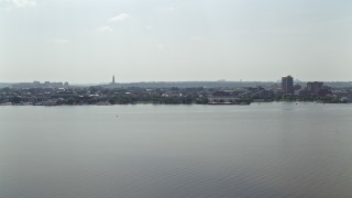 AX75_043 - 4.8K aerial stock footage of office buildings across the Potomac River in Alexandria, Virginia