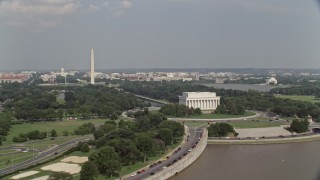 AX75_090 - 4.8K stock footage aerial video orbiting  Lincoln Memorial to reveal the National Mall in Washington DC