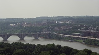 AX75_091 - 4.8K aerial stock footage of Georgetown University and Francis Scott Key Bridge in Washington DC