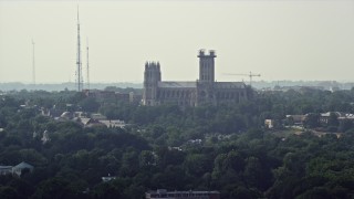 AX75_114 - 4.8K aerial stock footage of the Washington National Cathedral in Washington DC