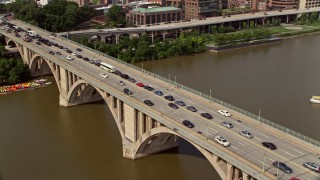 AX75_122 - 4.8K aerial stock footage of heavy traffic on the Francis Scott Key Bridge in Washington DC