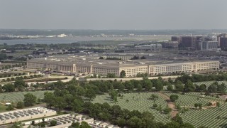 AX75_126E - 4.8K aerial stock footage of The Pentagon seen from Arlington National Cemetery in Washington DC