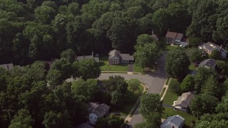 AX75_157 - 4.8K aerial stock footage of suburban streets with spacious homes in Annandale, Virginia