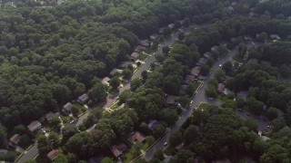 AX75_161 - 4.8K aerial stock footage tilting to bird's eye view of rows of suburban homes in Fairfax, Virginia