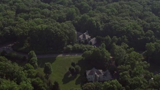 AX75_166 - 4.8K aerial stock footage tilting to a bird's eye view of a spacious mansion in Fairfax Station, Virginia