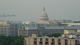 AX76_042E - 4.8K aerial stock footage flying by United States Capitol dome, Washington D.C., sunset