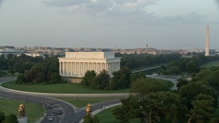 AX76_051 - 4.8K aerial stock footage Lincoln Memorial, Reflecting Pool, Washington Monument, National Mall, Washington D.C., sunset