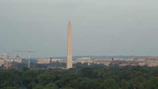 AX76_052 - 4.8K aerial stock footage of the Washington Monument, reveal the United States Institute of Peace, Washington D.C., sunset