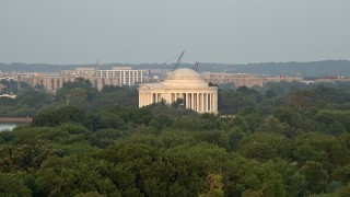 AX76_059 - 4.8K aerial stock footage approaching the Jefferson Memorial with tourists, Washington D.C., sunset
