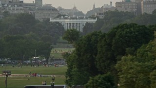 AX76_063 - 4.8K aerial stock footage flying by The White House, Washington D.C., sunset