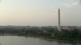 AX76_065 - 4.8K aerial stock footage of the Old Executive Office Building, The White House, and Washington Monument, Washington D.C., sunset